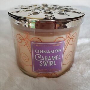Cinnamon Caramel Swirl 3-Wick candle by Bath and Body Works.